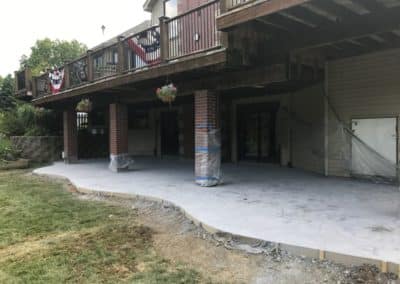 Stamped and Colored Concrete Patio Under Deck