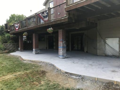 Stamped and Colored Concrete Patio Under Deck